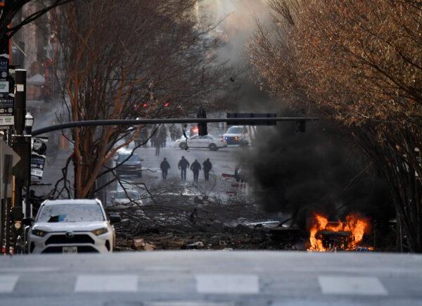 A vehicle burns near the site of an explosion in the area of Second and Commerce in Nashville, Tenn. on Dec. 25, 2020. (Andrew Nelles/Tennessean.com/USA Today Network via Reuters)