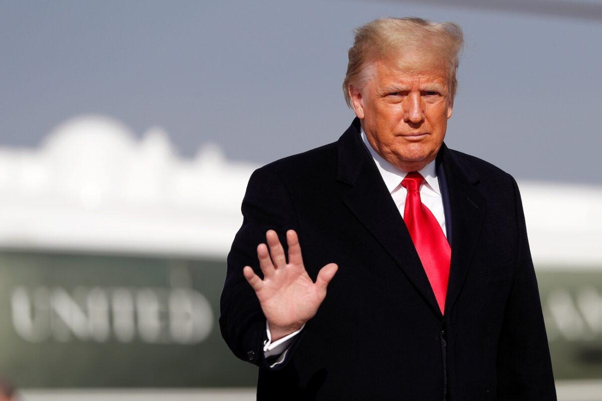 President Donald Trump waves before boarding Air Force One at Joint Base Andrews, Md., on Dec. 12, 2020. (Tom Brenner/Reuters)