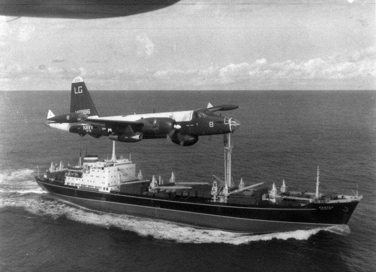 A U.S. patrol plane flies over a Soviet freighter during the Cuban missile crisis at the height of the Cold War in this 1962 photograph. (Getty Images)