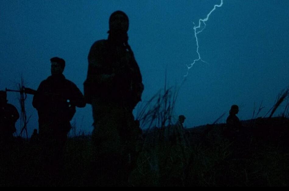 The 25th Infantry (Bravo Company) moves out on patrol on a rainy night, in "Platoon." (Orion Pictures)