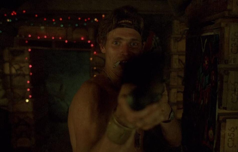Sergeant Elias (Willem Dafoe), proffering a shotgun "peace-pipe" in “Platoon.” (Orion Pictures)