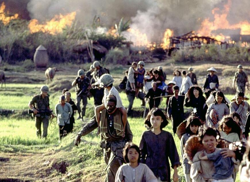 American soldiers burn a Vietnamese village, in "Platoon." (Orion Pictures)