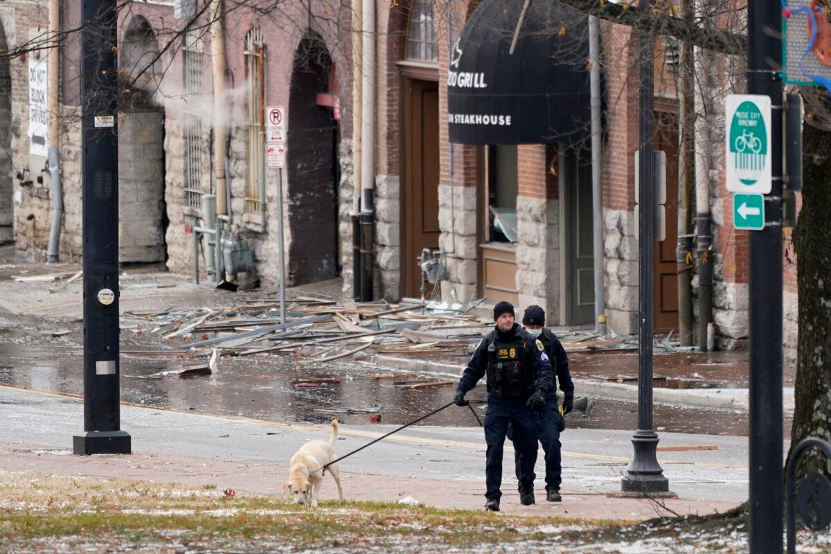 A K-9 team works in the area of an explosion in downtown Nashville, Tenn., on Dec. 25, 2020. (Mark Humphrey/AP Photo)