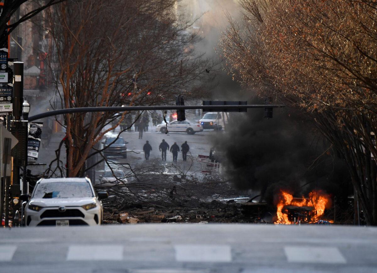 A vehicle burns near the site of an explosion in the area of Second and Commerce in Nashville, Tenn., on Dec. 25, 2020. (Andrew Nelles/Tennessean.com/USA Today Network via Reuters)