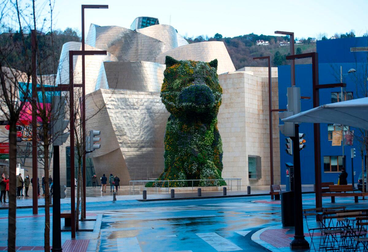 U.S. artist Jeff Koons's "Puppy" stands outside the Guggenheim Bilbao Museum in the Spanish Basque city of Bilbao on Dec. 26, 2020. (Ander Gillenea/AFP via Getty Images)