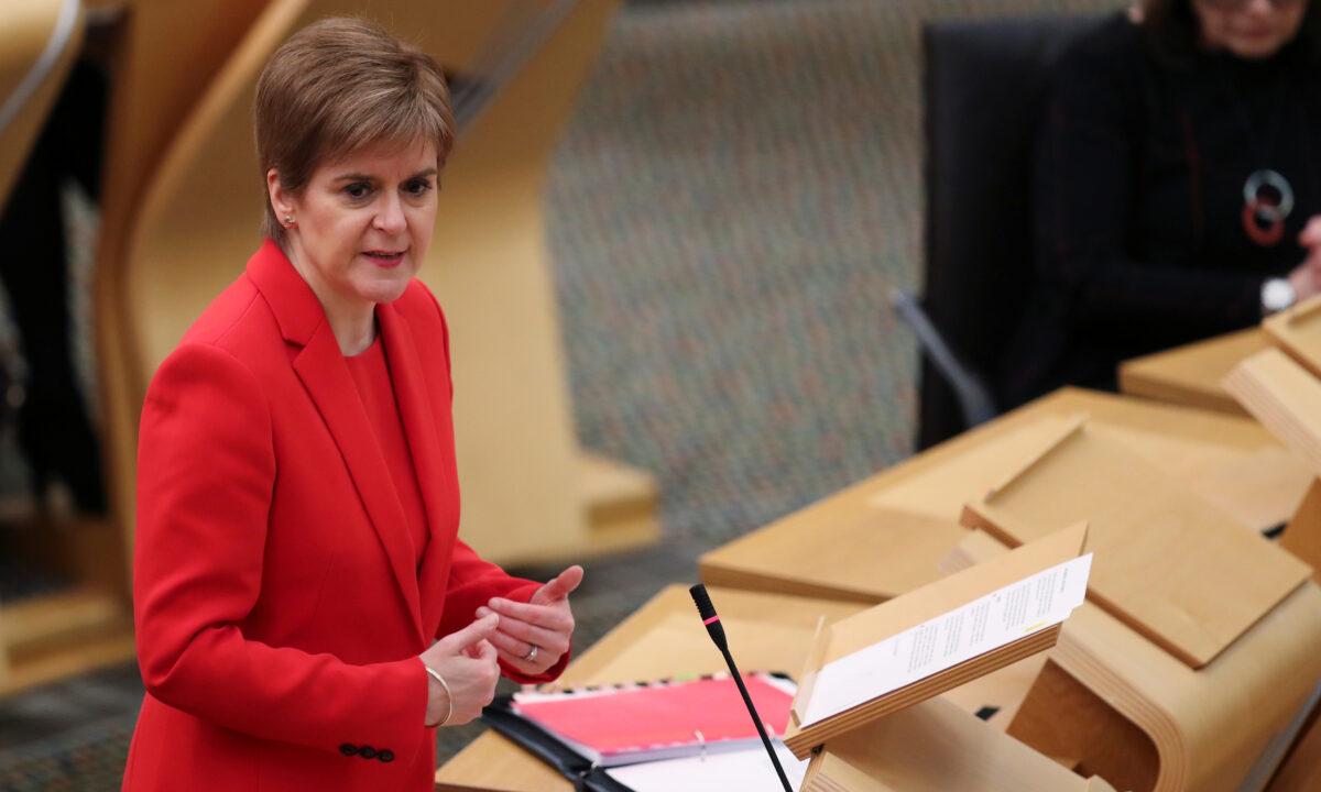 First Minister Nicola Sturgeon attends the Scottish Parliament where she delivers an update on CCP virus restrictions in Holyrood, Edinburgh, Scotland, on Dec. 22, 2020. (Russell Cheyne/Pool/AFP via Getty Images)