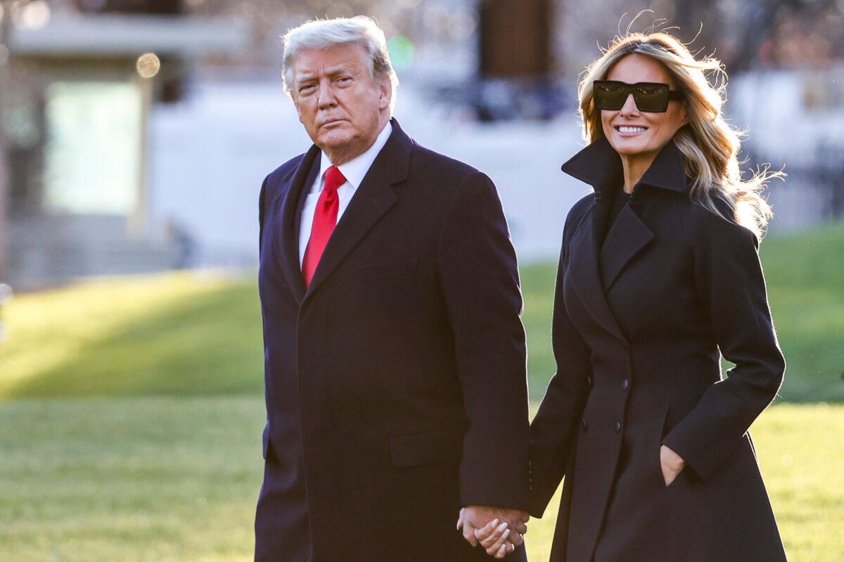  President Donald Trump and First Lady Melania Trump walk on the South Lawn of the White House on Dec. 23, 2020. (Tasos Katopodis/Getty Images)