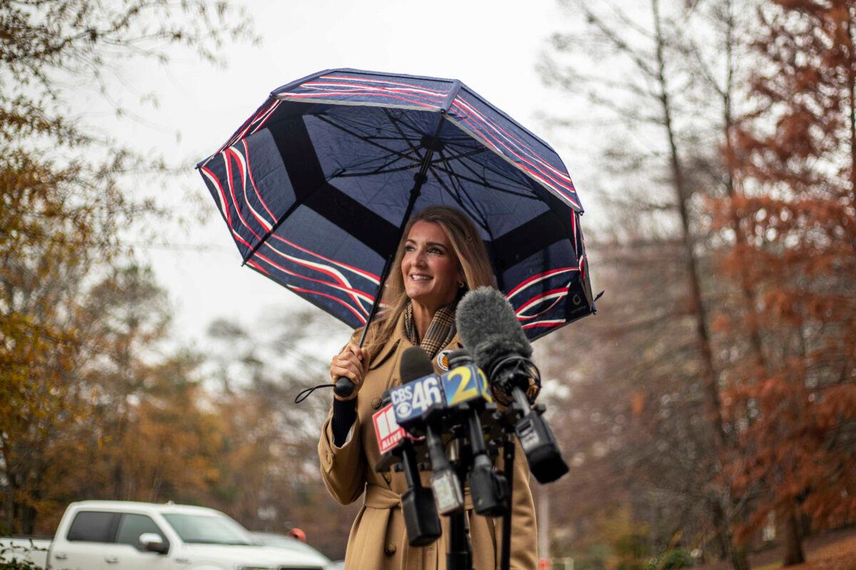 Sen. Kelly Loeffler (R-Ga.) speaks with members of the press after participating in early voting at Chastain Park Gymnasium in Atlanta, Ga., on Dec. 16, 2020. (Alyssa Pointer/Atlanta Journal-Constitution via AP)