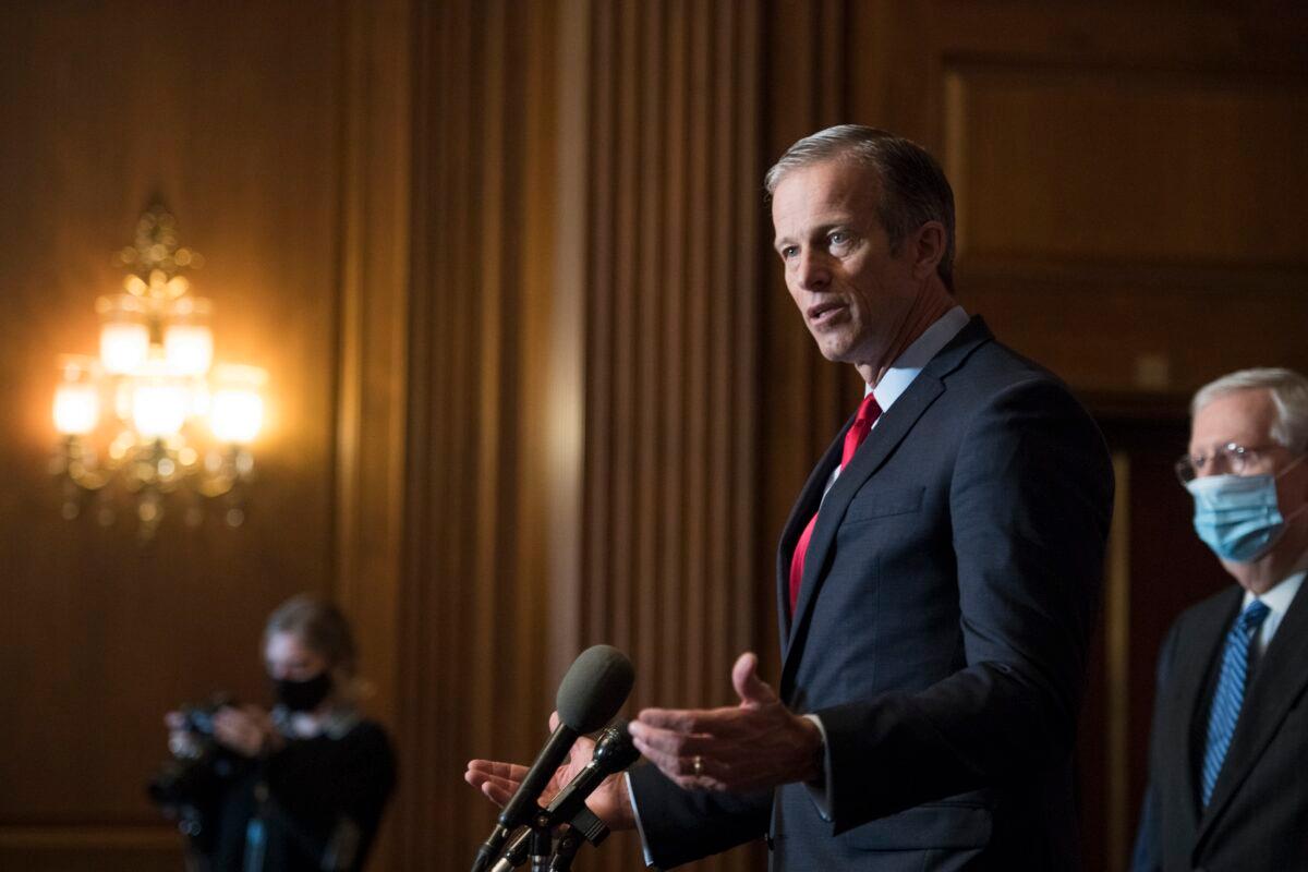 Sen. John Thune (R-S.D.) speaks to reporters in Washington on Dec. 15, 2020. (Rod Lamkey/Pool/Getty Images)