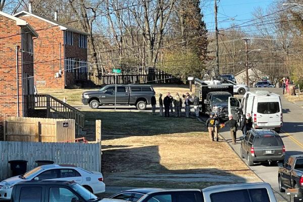 Law enforcement officers gather to search a house connected to Anthony Quinn Warner, in Antioch, Tenn., on Dec. 26, 2020. (Harrison McClary/Reuters)