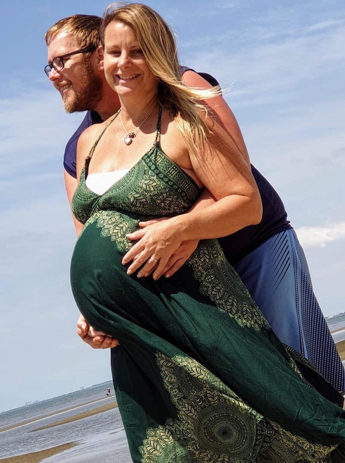  Adam with his wife, Dinah, when she was around 30 weeks pregnant with their daughter Brianna. (Caters News)