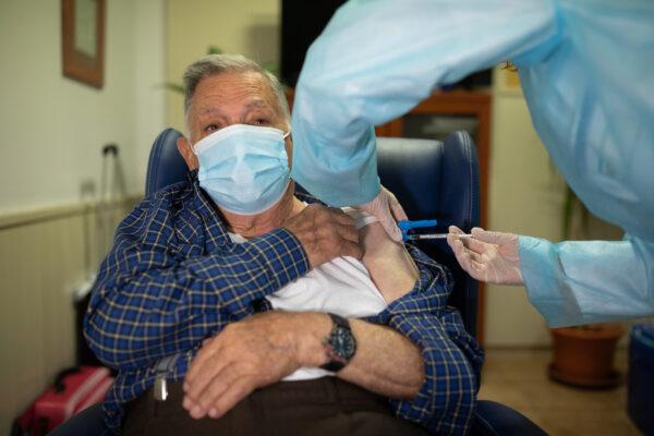 José Bruballa, 86, receives one of the first Pfizer/BioNTech Covid-19 vaccines in Spain at the Somontano nursing home on Dec. 27, 2020, in Barbastro, Spain. (Alvaro Calvo/Government of Aragon via Getty Images)
