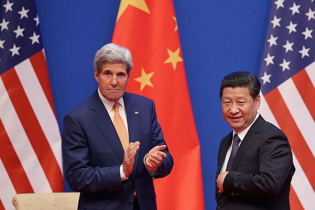 Chinese leader Xi Jinping and the then-U.S. Secretary of State John Kerry attend the opening ceremony of the 6th China–U.S. Security and Economic Dialogue and 5th round of China–U.S. High Level Consultation on People-to-People Exchange at Diaoyutai State Guest House in Beijing on July 9, 2014. (Feng Li/Getty Images)