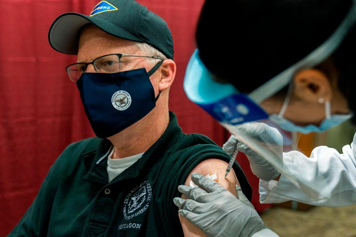 Acting Secretary of Defense Christopher Miller receives a COVID-19 vaccine at the Walter Reed National Military Medical Center in Bethesda, Md., on Dec. 14, 2020. (Manuel Balce Ceneta/Pool/AFP via Getty Images)