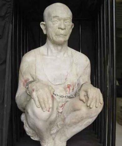 Zhang Kunlun’s self-depiction, 2002, of a common torture method he endured in China. (Courtesy of Kacey Cox from "Sacred Art")