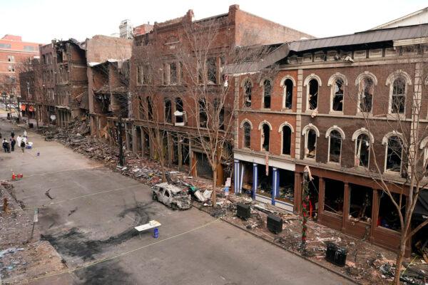 Debris remains on the sidewalks in front of buildings damaged in a Christmas Day explosion in Nashville, Tenn., on Dec. 29, 2020. (Mark Humphrey/AP Photo)