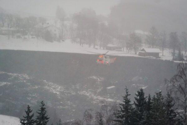 A rescue helicopter hoovers above the area of a landslide in Ask village, about 40km north of Oslo, Norway on Dec. 30, 2020. (Fredrik Hagen/NTB/via Reuters)