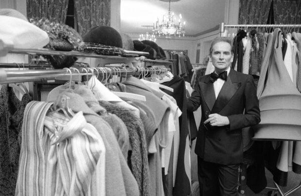 French designer Pierre Cardin poses in the dressing room at Hotel Pierre in New York City, on Oct. 30, 1975. (Ray Stubblebine/AP Photo)