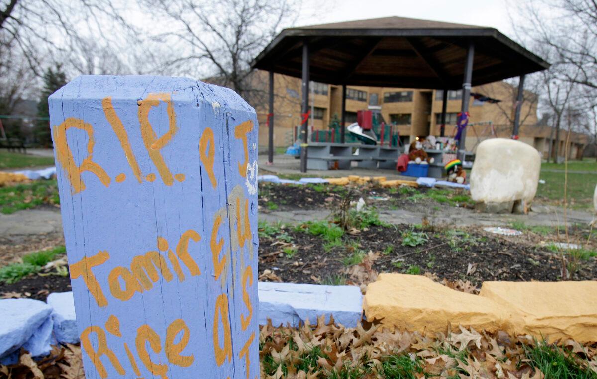 In this Dec. 29, 2015, file photo, "R.I.P. Tamir Rice" is written on a wooden post near a makeshift memorial at the gazebo where the boy was fatally shot, in Cleveland, Ohio, on Nov. 22, 2014. (Tony Dejak/AP Photo)