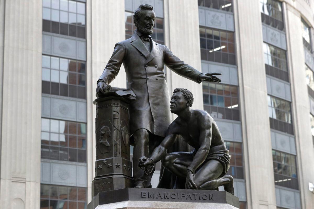 A statue that depicts a freed slave and President Abraham Lincoln is seen in Boston, Mass., in a file photograph. (Steven Senne/AP Photo)