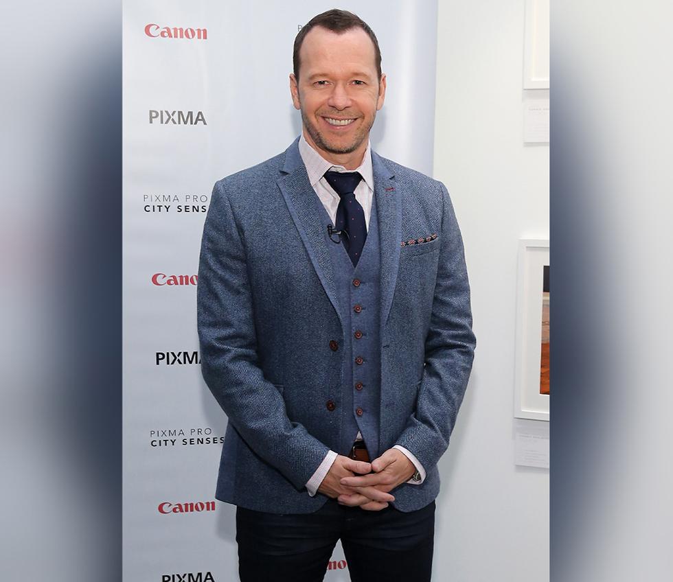 Donnie Wahlberg reveals his photographs printed on the Canon PIXMA PRO printers at the Canon PIXMA PRO City Senses Gallery at EpiCenter in Boston on Sept. 17, 2014. (Neilson Barnard/Getty Images)
