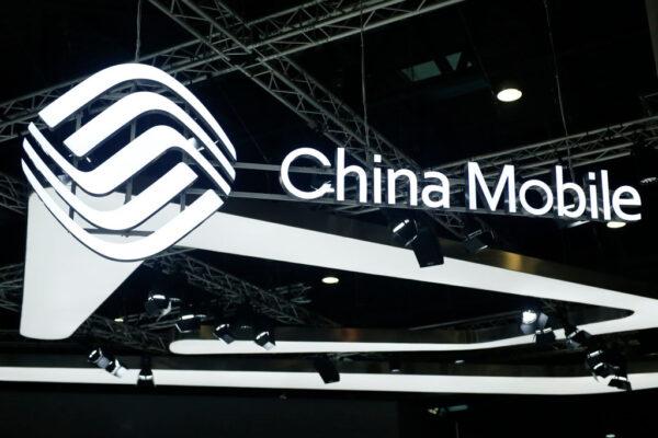 The China Mobile logo is displayed at the Mobile World Congress in Barcelona, Spain, on Feb. 26, 2019. It is one of three Chinese telecom firms that will be delisted from the New York Stock Exchange. (Pau Barrena/AFP via Getty Images)