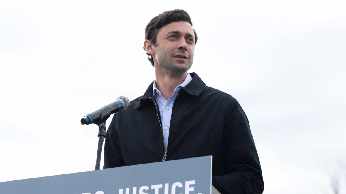 Georgia Democratic Senate candidate Jon Ossoff speaks to the crowd during an "It's Time to Vote" drive-in rally in Stonecrest, Ga, on Dec. 28, 2020. (Jessica McGowan/Getty Images)
