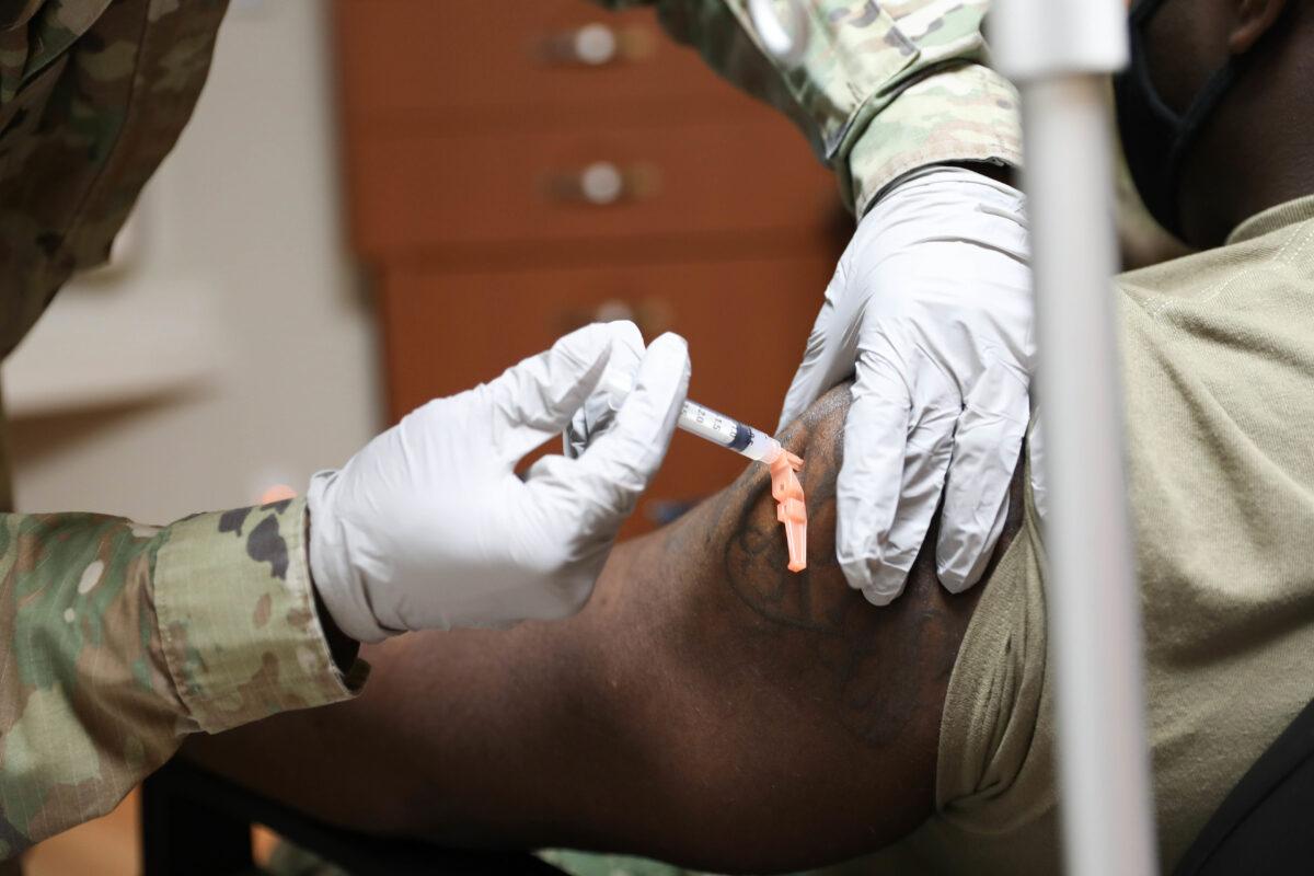 A member of the military is injected with Moderna's COVID-19 vaccine in Pyeongtaek, South Korea, on Dec. 29, 2020. (United States Forces Korea via Getty Images)