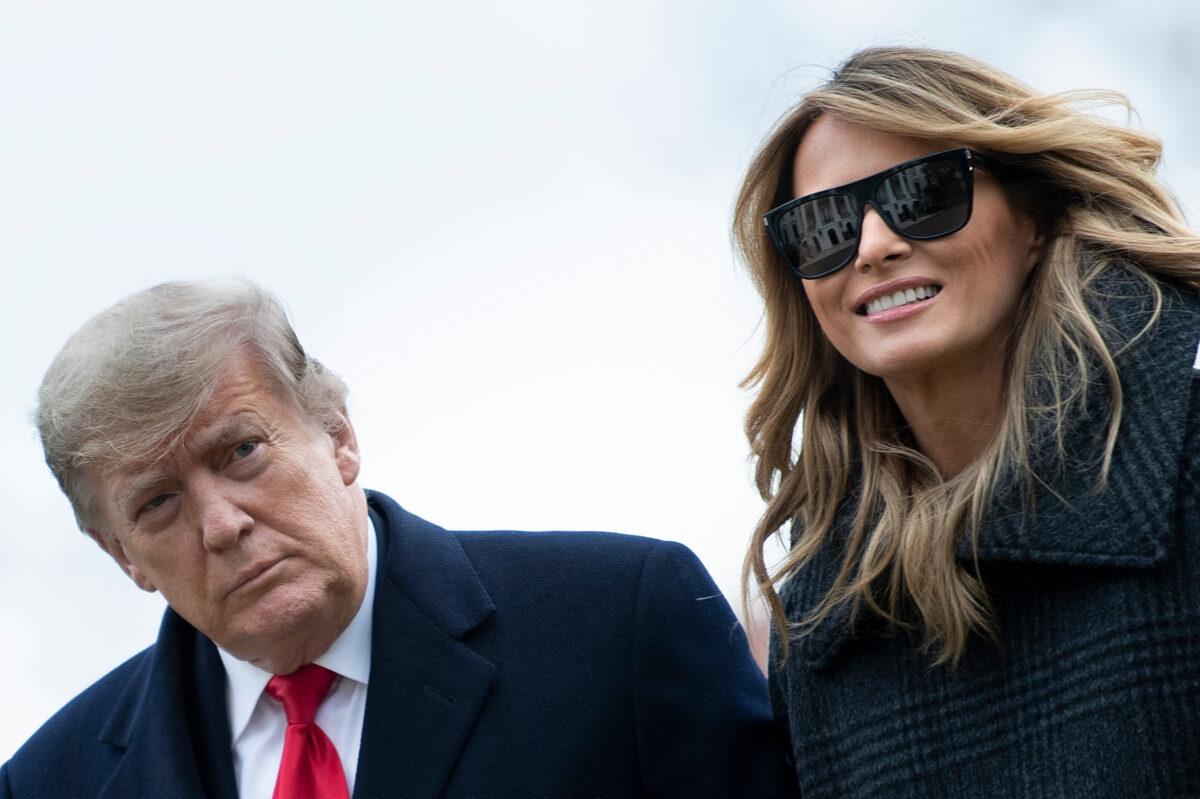 President Donald Trump and First Lady Melania Trump walk from Marine One as they return to the White House in Washington on Dec. 31, 2020. (Brendan Smialowski/AFP via Getty Images)