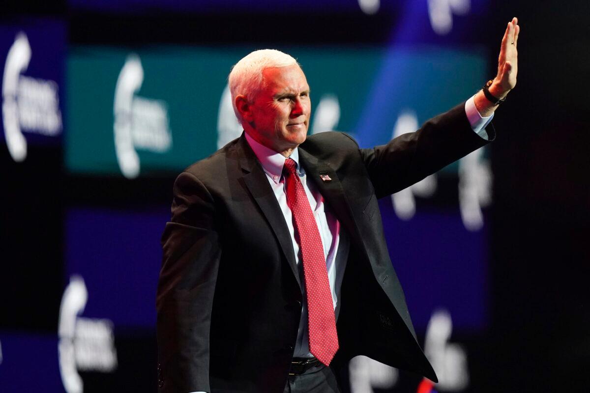Vice President Mike Pence waves as he walks off the stage after speaking at the Turning Point USA Student Action Summit in West Palm Beach, Fla., on Dec. 22, 2020. (Lynne Sladky/AP Photo)
