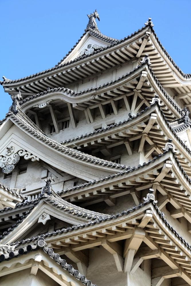 A detail showing Himeji Castle’s elegant yet functional wooden architecture. (Pixeljoy/Shutterstock.com)