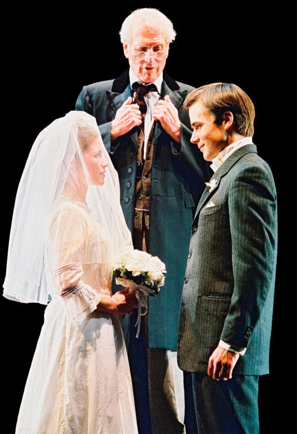 Paul Newman (C) as the Stage Manager performing the wedding ceremony of Emily (Maggie Lacey) and George (Ben Fox), in a Broadway revival of "Our Town." (Joan Marcus/Getty Images)