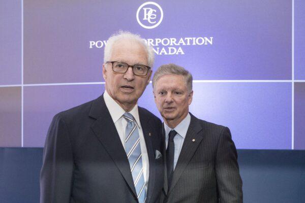 André Desmarais and Paul Desmarais Jr., then-co-CEOs of Power Corporation who have since retired, before the start of their company’s annual meeting in Toronto on May 14, 2019. (The Canadian Press/Chris Young)