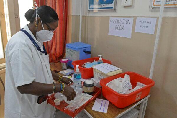 A health official prepares a vaccine kit as she takes part in dry run or a mock drill for COVID-19 vaccine delivery at a primary health center in Hyderabad, India, on Jan. 2, 2021. (Noah Seelam/AFP via Getty Images)