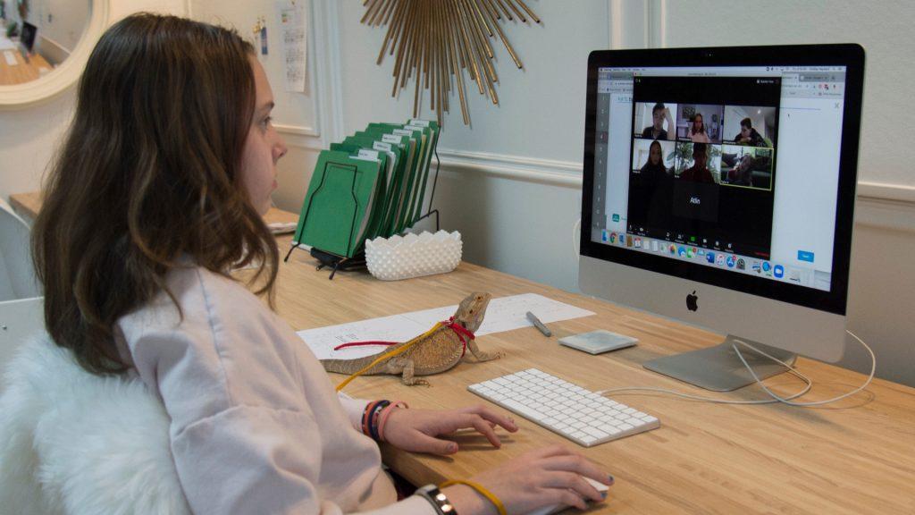 A Grade 6 student takes part in a virtual school session with her teacher and classmates via Zoom from her home. (The Canadian Press/Jonathan Hayward)