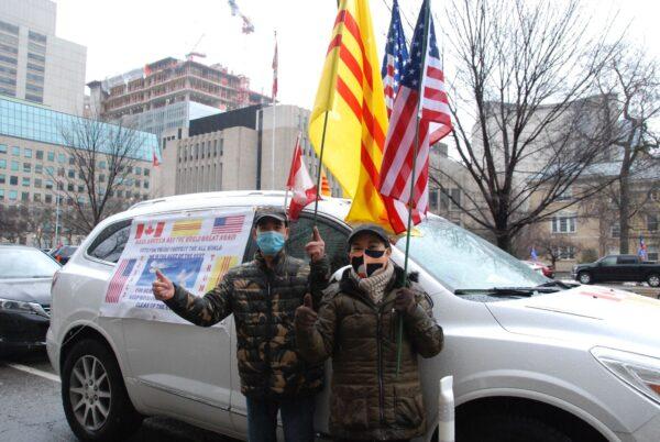 Paul Phong (L) and his wife at the rally on Jan. 3. Phong, a Vietnamese immigrant, said: "He (Trump) is the greatest man, he doesn't like communism. He is real supporter of human rights, freedom, and democracy. If Biden wins, the U.S. will become a communist country. Take a look at Hong Kong and you'll understand." (Michelle Hu/The Epoch Times)