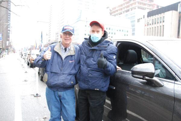 John Ziraco, a retired IBM engineer, joined the rally with his son. (Michelle Hu/The Epoch Times)