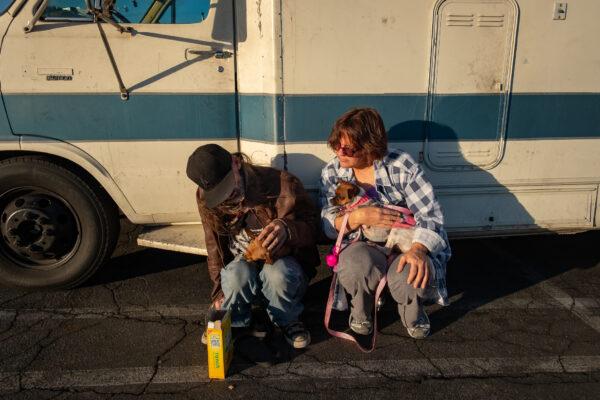 William Abercrombie, who lives in his RV, sits with his sister, Ann Gray, who also used to live in her vehicle, in Fullerton, Calif., on Dec. 10, 2020. (John Fredricks/The Epoch Times)