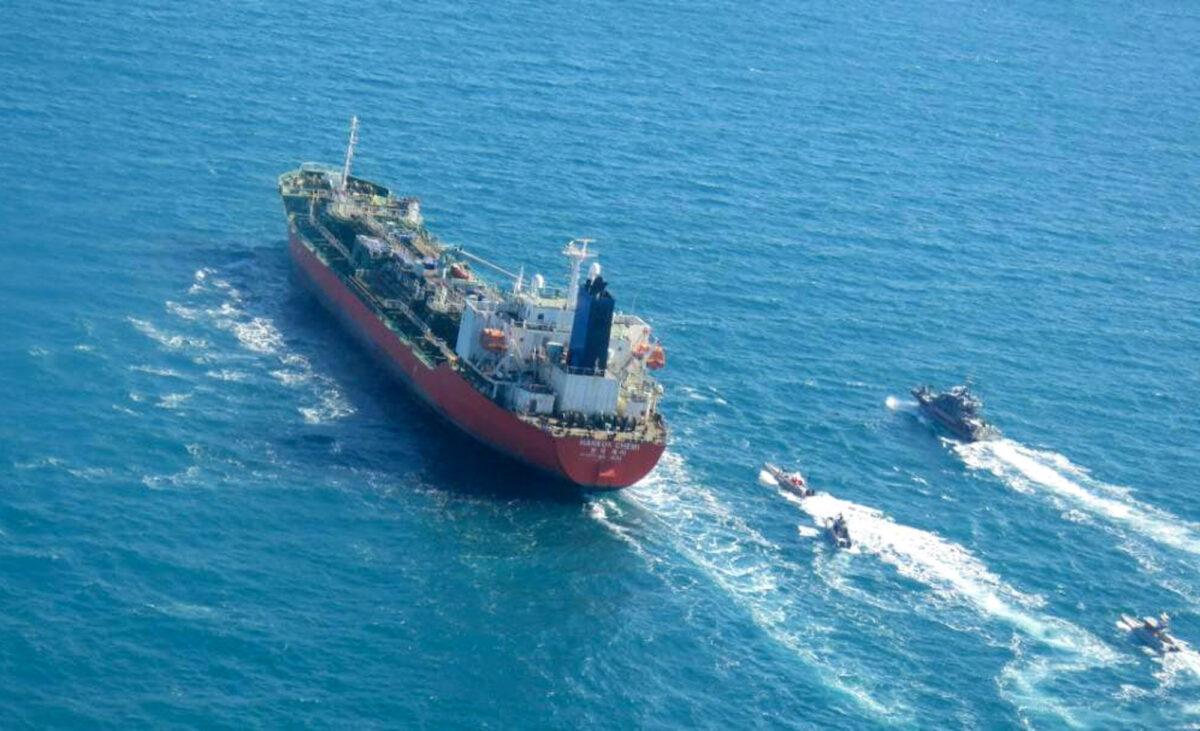 A picture shows the South Korean-flagged tanker being escorted by Iran's Revolutionary Guards navy after being seized in the Gulf. (Tasnim News/AFP via Getty Images)