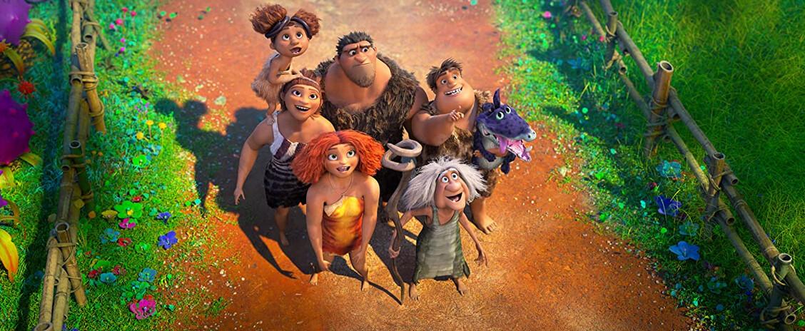 (L–R) Sandy (voiced by Kailey Crawford), Ugga (Catherine Keener), Eep (Emma Stone), Grug (Nicholas Cage), Gran (Cloris Leachman), Thunk (Clark Duke), and Douglas the croc-dog, looking at the Bettermans' treehouse, in "The Croods: A New Age." (Universal Pictures)