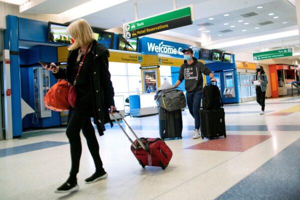 Passengers arrive on a flight from London amid new restrictions to prevent the spread of COVID-19 at JFK International Airport in New York City on Dec. 21, 2020. (Eduardo Munoz/Reuters)