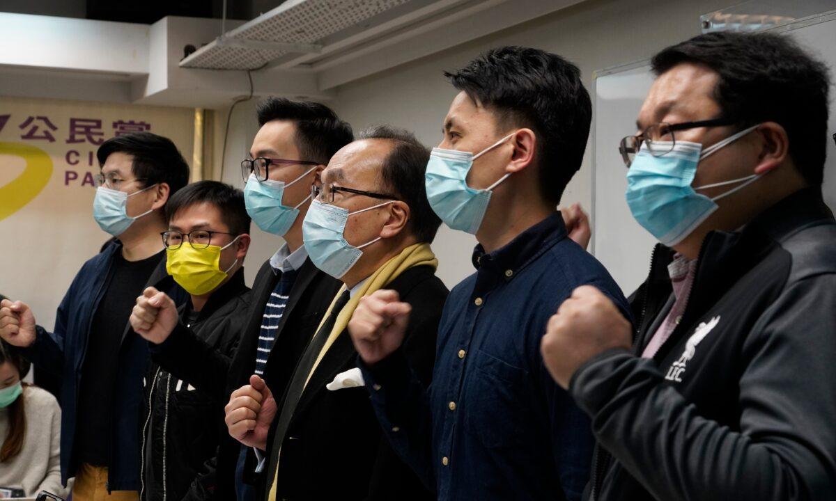 Pro-democratic party members shout slogans in response to the mass arrests during a press conference in Hong Kong, on Jan. 6, 2021. (Vincent Yu/AP Photo)