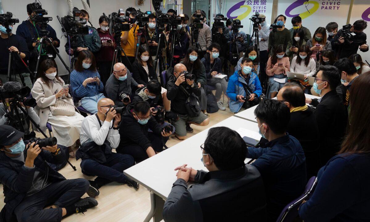 Pro-democratic party members respond to the mass arrests during a press conference in Hong Kong, on Jan. 6, 2021. (Vincent Yu/AP Photo)