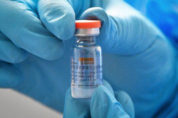 A medical worker shows a vial of vaccine against the COVID-19 at a healthcare centre in Yantai, in eastern China's Shandong Province on Jan. 5, 2021. (STR/AFP via Getty Images)