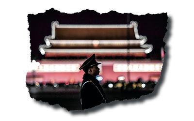 A Chinese police officer on Tiananmen Square in Beijing on March 11, 2018. (GREG BAKER/AFP via Getty Images)