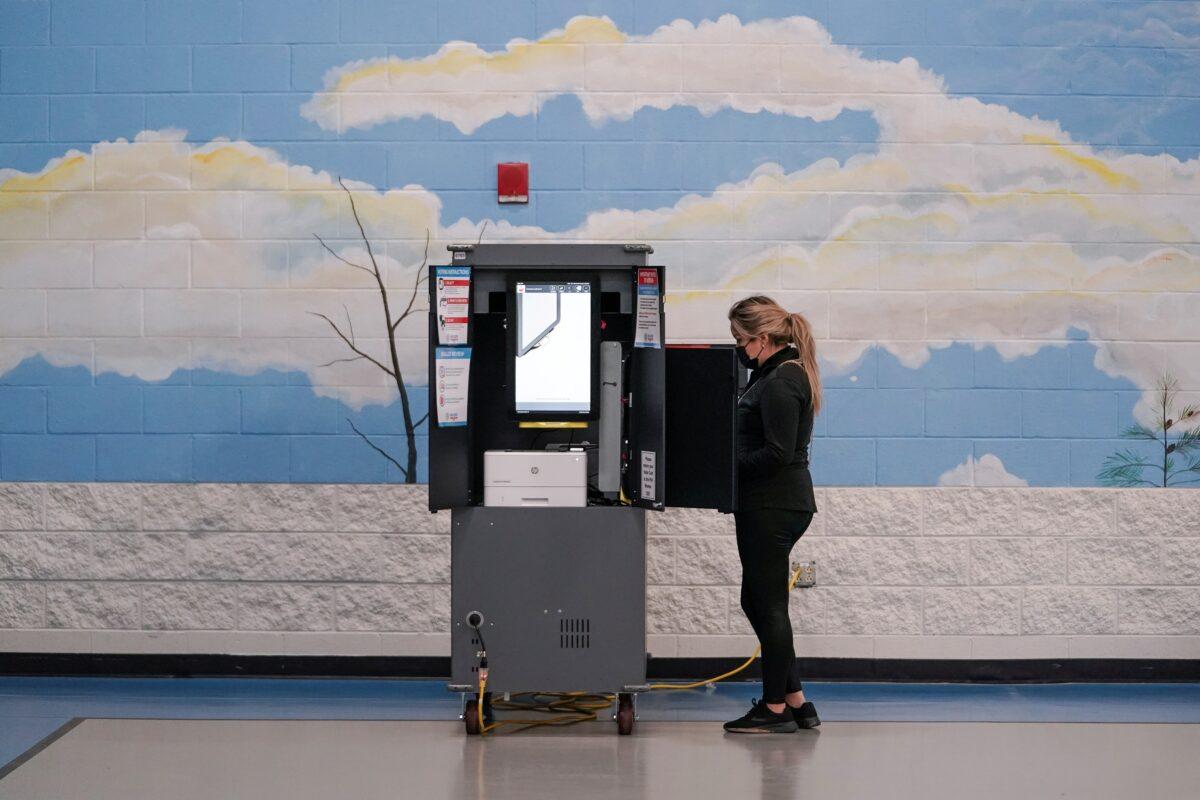 Voters cast their ballots in Georgia’s Senate runoff elections at a Fulton County polling station in Atlanta on Jan. 5, 2021. (Elijah Nouvelage/Reuters)