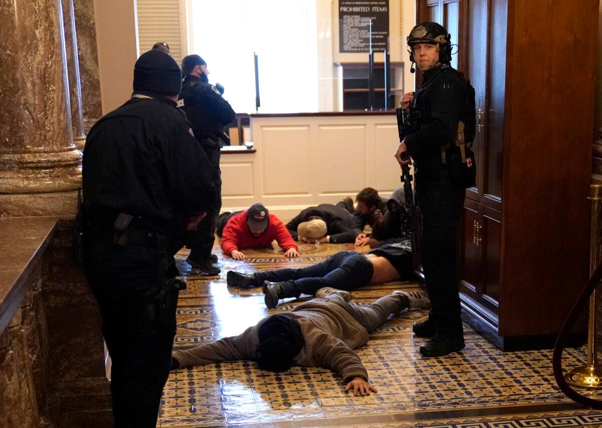 U.S. Capitol Police detain people who entered the U.S. Capitol building in Washington on Jan. 6, 2021. (Drew Angerer/Getty Images)