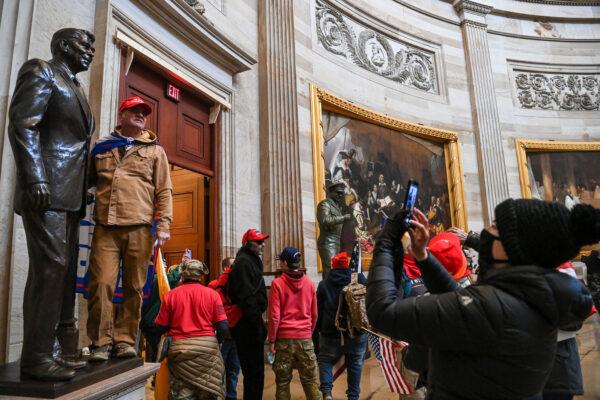  A group of protesters enter the U.S. Capitol Rotunda in Washington on Jan. 6, 2021. (Saul Loeb/AFP via Getty Images)