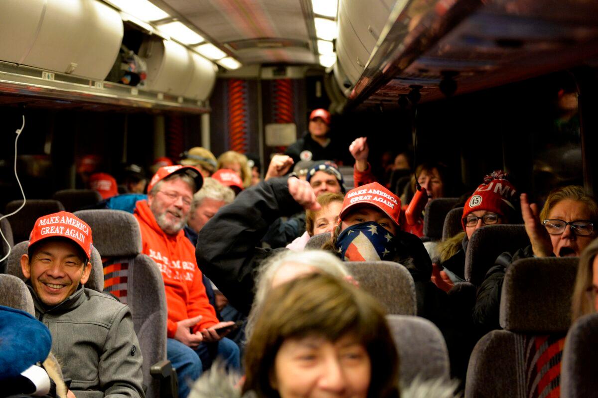 President Donald Trump supporters cheer before leaving on a bus for an overnight drive to Washington, in Newton, Mass., on Jan. 5, 2021. (Joseph Prezioso/AFP via Getty Images)