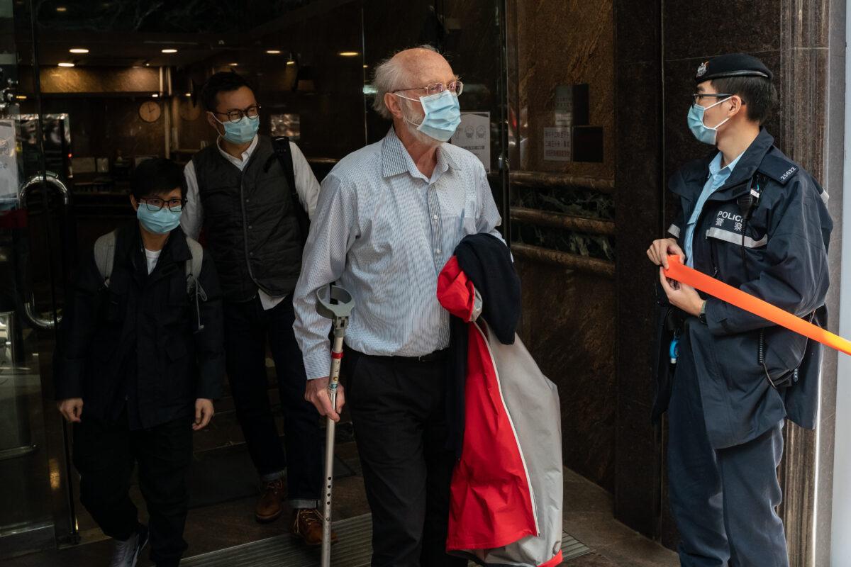 John Clancey, a human rights lawyer, is led away from his office by police after being arrested in Hong Kong on Jan. 6, 2020. (Anthony Kwan/Getty Images)